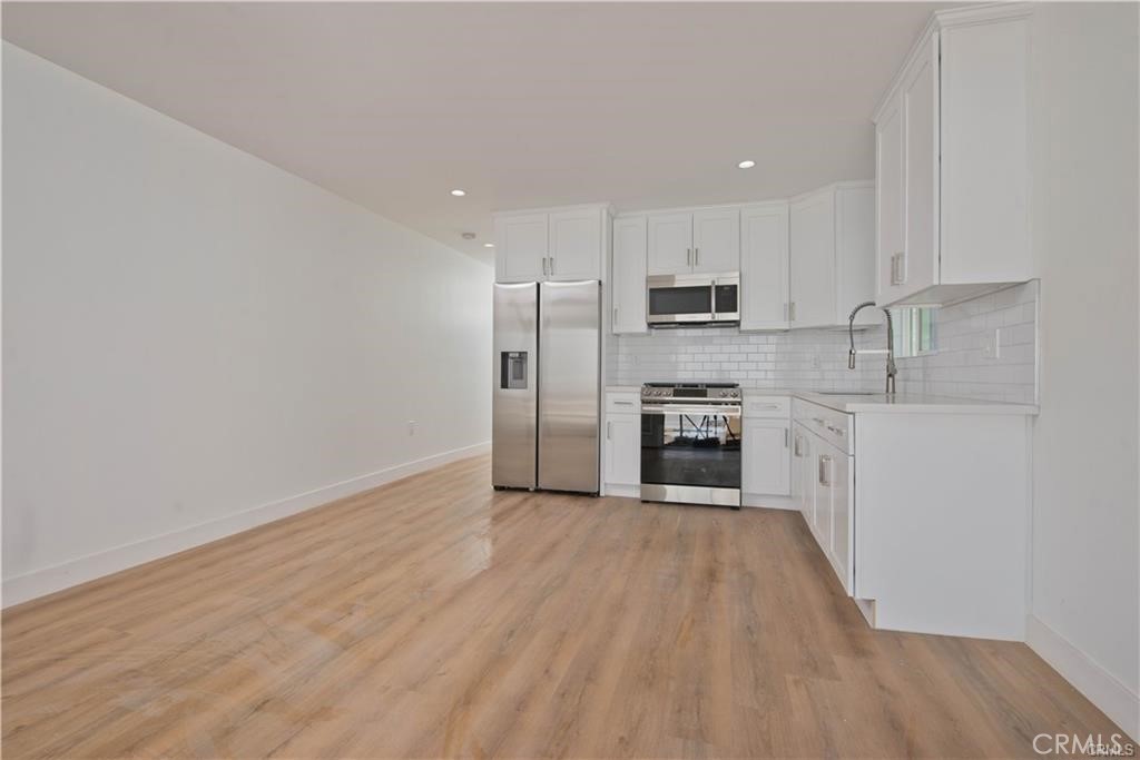 Welcome to Lake Balboa's charming 1 bed, 1 bath Accessory Dwelling Unit (ADU). This cozy living space is nestled in the heart of the vibrant and sought-after Lake Balboa neighborhood, offering a perfect blend of comfort, convenience, and tranquility. As you step into this ADU, you are greeted by an inviting open-concept layout that maximizes the available space. The living area seamlessly connects with the kitchen, creating a warm and welcoming atmosphere. Natural light streams in through large windows, illuminating the space and creating an airy ambiance. The kitchen is thoughtfully designed, featuring modern appliances, ample cabinet space, and sleek countertops. It provides everything you need to prepare delicious meals and entertain guests. Whether you're whipping up a quick breakfast or indulging in a gourmet dinner, this kitchen is a delightful space to let your culinary skills shine. The bedroom is a peaceful sanctuary, offering a tranquil retreat at the end of a long day. With enough space to accommodate a comfortable bed and storage for your belongings, it ensures a restful night's sleep. The bedroom also enjoys an abundance of natural light, creating a bright and soothing environment. Outside, you'll find a lovely patio area where you can soak up the sunshine, enjoy a morning coffee, or simply bask in the serene surroundings. The patio serves as an extension of your living space and is an ideal spot for outdoor dining or entertaining guests.
This ADU in Lake Balboa offers convenient amenities, including in-unit laundry facilities, Large storage closet, and private access. The neighborhood itself boasts beautiful tree-lined streets, well-maintained parks, and a welcoming community atmosphere. With its prime location, you'll have easy access to the stunning Lake Balboa Park, renowned for its picturesque lake, walking trails, and recreational activities. Additionally, you'll find an array of dining options, shopping centers, and entertainment venues just a short distance away. Overall, this 1 bed, 1 bath ADU in Lake Balboa provides a comfortable and stylish living space that embraces the essence of modern living.
