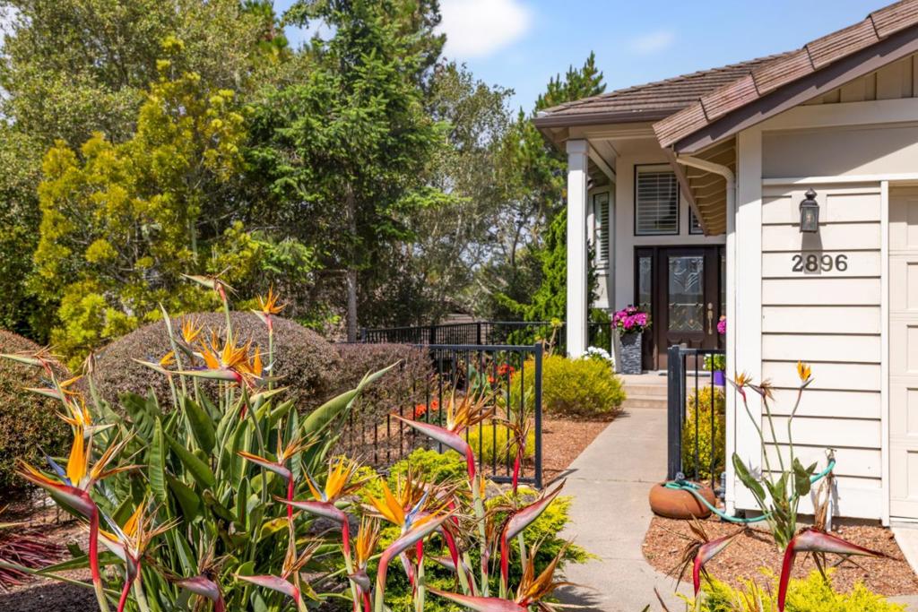 If your idea of the perfect Pacific Grove retreat is a light, and welcoming 3-bedroom, 3-bath townhouse with updates already done, a stone's throw from absolutely everything the Monterey Bay area has to offer... Here it is! Welcome to Pacific Grove's jewel on the hill, Glen Heights. A Planned Unit Development of 36 units, situated for ease of access to shopping, world class dining and recreation. This home has over 2400 square feet of living space, two large decks and a large two car garage with extra storage space. This split level home is designed with the primary suite on the ground floor with a fireplace, beautiful architectural windows, and a deck overlooking the forest. Primary bath and dressing areas have been tastefully updated. Adjacent is a junior suite, with updated bath. Upstairs offers a fully renovated kitchen, light, bright and well appointed with stainless steal appliances. A formal dining room, and spacious livingroom with fireplace and outdoor deck round out the common living space, with an additional bedroom and updated bath.