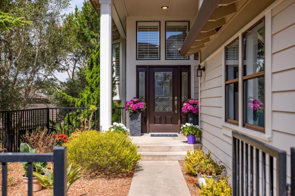 Stunning fully renovated townhome, light, bright and welcoming 3-bedroom, 3-bath, with a peek of the ocean. Excellent location, just a stone's throw from absolutely everything the Monterey Bay area has to offer... Welcome to Pacific Grove's jewel on the hill, Glen Heights. A Planned Unit Development of 36 units, situated for ease of access to shopping, world class dining and recreation. This home has over 2400 square feet of living space, two large decks and a large two car garage with extra storage space. This split level home is designed with the primary suite on the ground floor with a fireplace, beautiful architectural windows, and a deck overlooking the forest. Primary bath and dressing areas have been tastefully updated. Adjacent is a junior suite, with updated bath. Upstairs offers a fully renovated kitchen, light, bright and well appointed with stainless steal appliances. A formal dining room, and spacious livingroom with fireplace and outdoor deck round out the common living space, with an additional bedroom and updated bath.