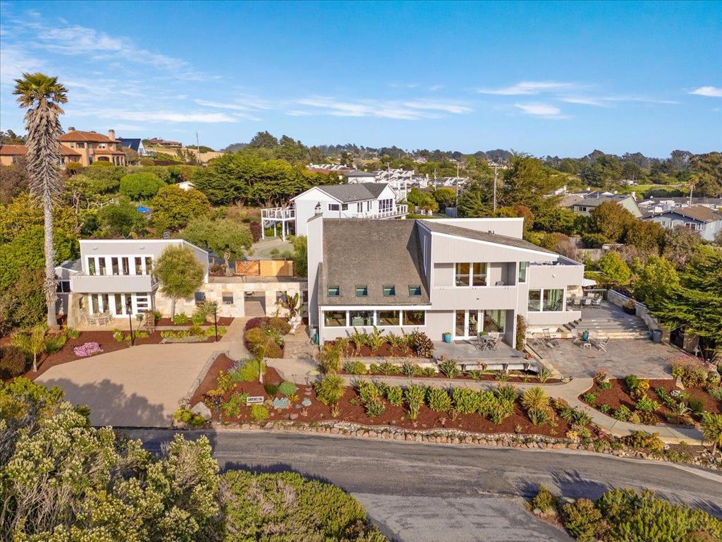 Amazing Home and Guest House! Perched on a coveted bluff with sweeping ocean views, this stunning beach house blends thoughtful design with effortless elegance. The main home features 3 bedrooms and 2.5 bathrooms, plus an outdoor shower, soaring ceilings, and a seamless open layout that captures the beauty of the coast from nearly every room. The home is surrounded by meticulously landscaped grounds, featuring vibrant coastal plantings, mature greenery, and carefully curated outdoor living spaces that create a sense of privacy and serenity. In the back, a private yard oasis features brand new AstroTurf for low-maintenance, year-round enjoyment, perfect for entertaining, lounging, or simply soaking in the salty air. A separate guest casita (781 sqft) offers the perfect retreat for visitors, a creative studio, or a private workspace, flexible and tucked away for added privacy. A private pathway leads directly down to the beach...ideal for morning walks, sunset strolls, or spontaneous surf sessions. Impeccably designed and beautifully maintained, this home is a rare find in an unbeatable location. A true sanctuary where every detail has been carefully considered, and the views take center stage.