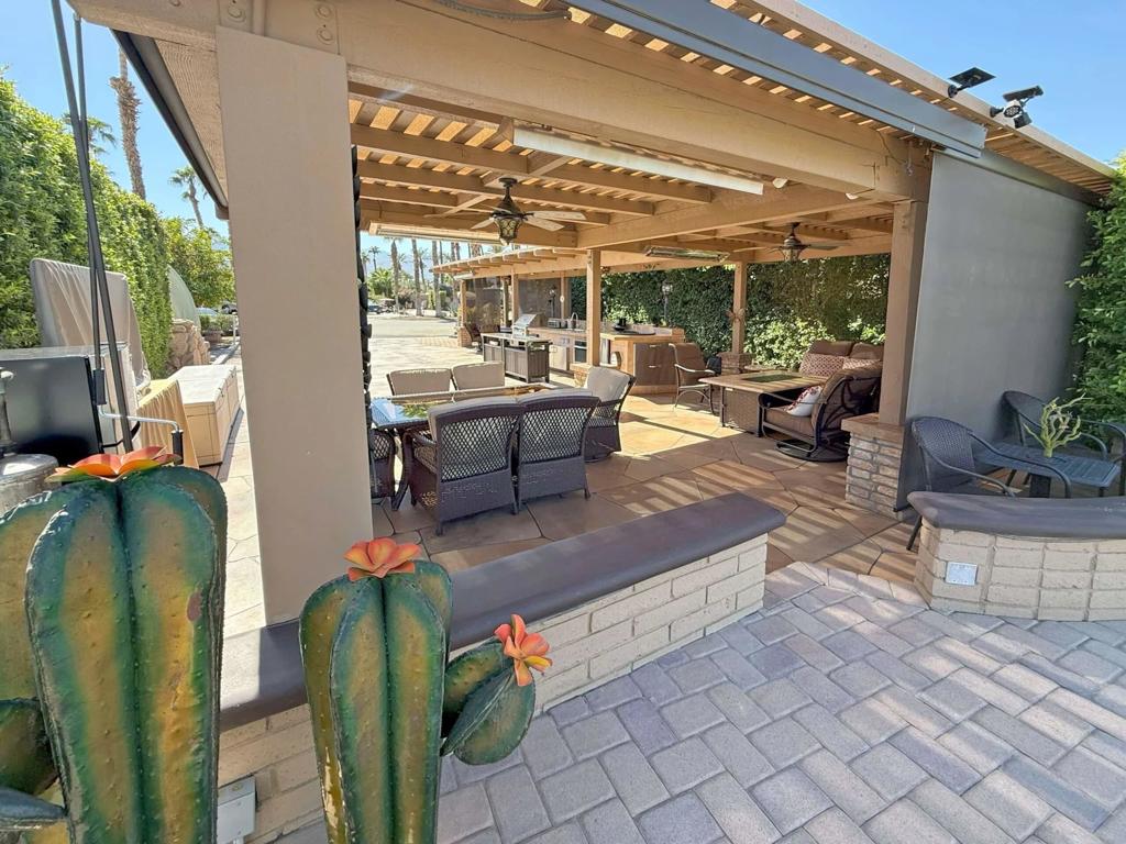 Experience luxury at RV Lot #31 in Outdoor Resort Indio, featuring breathtaking water views of the lake, fountain, and golf course from its serene northeast-facing cul-de-sac location. Enjoy easy straight back-in with this lot. Privacy hedges create a tranquil retreat, while the L-shaped pergola, with a new 2024 roof and built-in electric heaters, ensures comfort. Just a short walk to the satellite pool and laundry, this lot blends convenience and elegance.The fully equipped outdoor kitchen includes a BBQ, sink, two refrigerators, oven, cooktop, and ample storage. High-quality furnishings feature dining sets, firepit tables, drop down shades, and a 65-inch TV on a rolling toolbox. Extras like a leaf blower, and storage boxes make this move-in-ready lot perfect for motorcoach enthusiasts seeking resort-style living.Outdoor Resort Indio is a class-A only RV community.