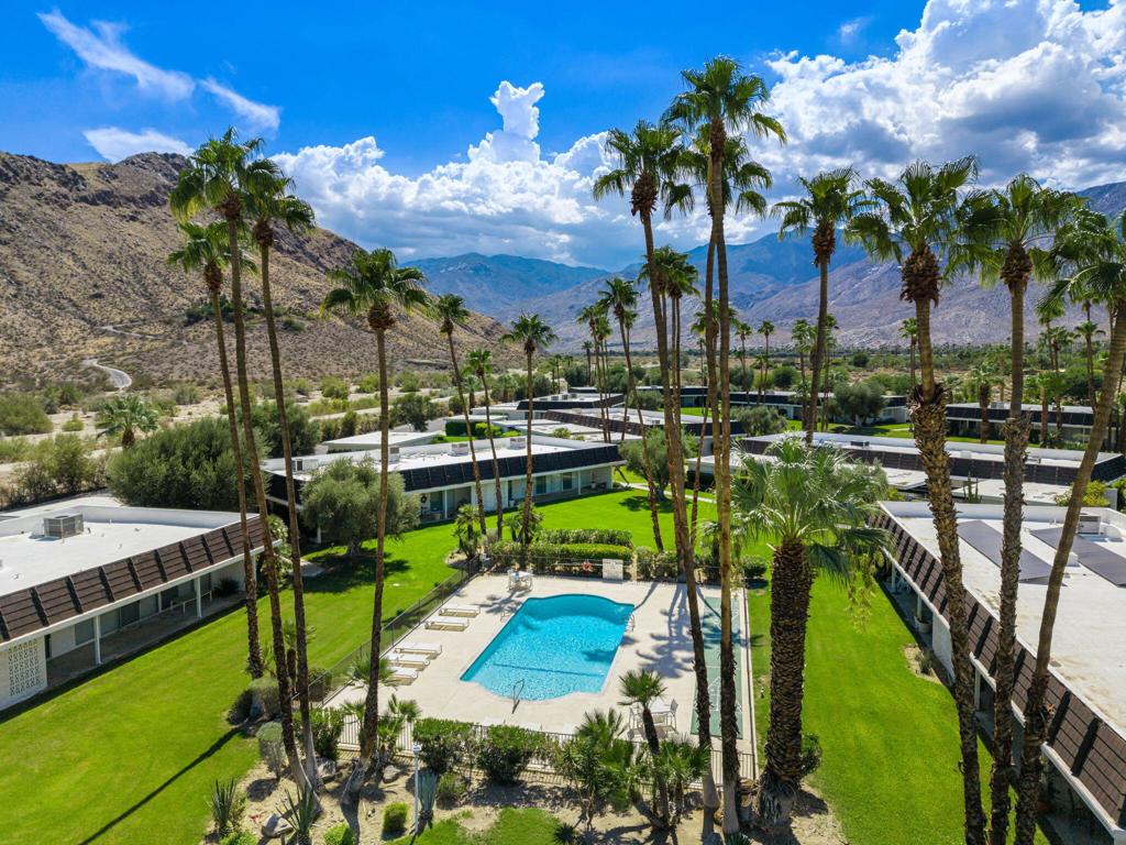 Rarely Available and Architecturally Significant, this stunning Mid-Century Modern meets Hollywood Regency style home was designed by the iconic John Elgin Woolf. Built in 1971, one of only three communities in the desert designed by Woolf, this property exudes character and charm This home offers 3 spacious en-suite bedrooms and 2,466 sq ft of sophisticated living space. Nestled beneath the desert mountains in a Private Enclave of 26-homes and spread across 10 meticulously maintained acres, Marabelle Estates has some of the most Breathtaking Mountain views in all of the desert.Walls of glass and Dramatic high ceilings flood the interior with natural light, seamlessly connecting indoor and outdoor living. Enjoy a private atrium patio, perfect for relaxing or entertaining. This home features Generously sized rooms, well-appointed kitchen w/plenty of storage and walk-in pantry, complemented by a wet bar, skylights, walk-in closets, and private laundry room.Community amenities include two pools, spas, and tennis court, all set in Lush, Resort-style surroundings. Just minutes to premier shopping, dining, and everything Palm Springs has to offer.