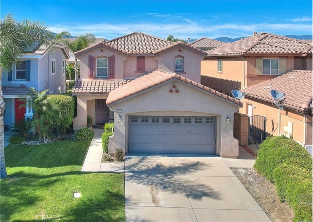 This is a remarkable two stories house nested in the Sierra Lakes Golf Community, Fontana offering almost 2320 square feet of newly built in 2005, meticulously designed living space, this residence encompasses three bedrooms and three full bathrooms, providing ample room for comfortable living and privacy. Upon entering the open living space, you are immediately captivated by the seamless flow and thoughtful layout of this home. The spacious living area is bathed in natural light, creating an inviting atmosphere for relaxation and entertainment. The open concept design effortlessly connects the living area to the dining space and gourmet kitchen, allowing for effortless socializing and family gatherings. The well-appointed kitchen is a chef's delight, equipped with modern appliances, sleek countertops, and an abundance of cabinetry and a pantry room. The three bedrooms in this house provide retreats of tranquility and comfort. The master suite stands out as a true oasis, featuring a spacious bedroom area, and a luxurious on-suite bathroom. With dual sinks, a soaking tub, and a separate shower, the master bathroom offers a spa-like experience, perfect for unwinding after a long day. The additional bedrooms are located away from the master bedroom with a full bathroom in between offering more quietness and privacy. Beyond the confines of the house, a covered patio area and a low maintenance backyard allows for great barbequing and outdoor seating, ideal for hosting gatherings and creating lasting memories with loved ones. This is not just a house; it is an embodiment of comfort, functionality, and contemporary living. With its generous living space, and meticulous design This ready to move in residence offers a place where you can truly make a house a home.