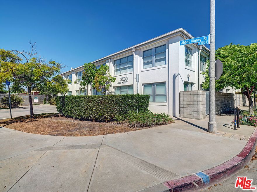 Experience the best of Venice living in this striking 3-bedroom, 3-bathroom live/work residence designed by renowned architect Mark Mack.  Encompassing 3,269 square feet of inspired design, this home offers a rare combination of scale, flexibility, and style in a secured, well-maintained 7-unit complex on famed Abbot Kinney Boulevard.  Inside, soaring ceilings, abundant natural light, and hardwood floors throughout create a clean, modern aesthetic.  The main living level features a bright open floor plan with custom cabinetry, high-end appliances, and generous entertaining areas.  The primary suite is privately positioned away from the main living areas, while the two additional bedrooms each feature their own lofts, offering versatile space for lounging, study, or creative work.  The top-level loft with floor-to-ceiling windows makes an ideal home office or other flex space.  On the first level, an expansive artist's studio with en-suite bathroom (which can also be used as fourth bedroom) opens directly to the wraparound garden, a tranquil outdoor sanctuary with two seating areas with fire pits--perfect for relaxing or entertaining.  Additional features include an in-unit laundry room with full-size washer and dryer, a private two-car garage, and two additional secured parking spaces (four total).  With both residential and commercial zoning, this one-of-a-kind home adapts effortlessly to your lifestyle, whether used as a residence, workspace, or both on one of Los Angeles' most desirable streets.