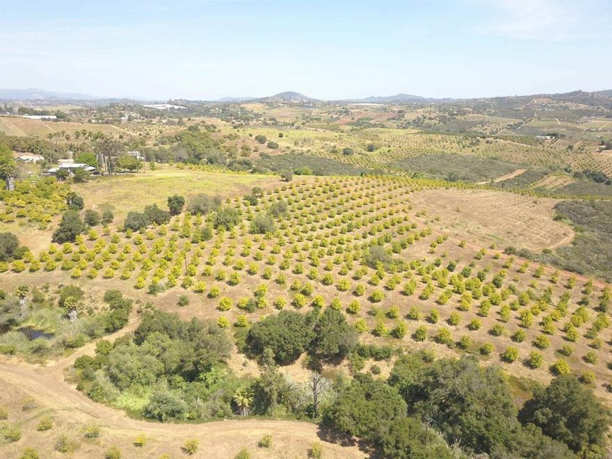 Welcome to Birdsong Ranch, an expansive 54.3-acre haven surrounded by the tranquility of nature. Boasting organic Eureka lemon trees and two functional wells, this picturesque property ensures abundant harvests. An additional lemon trees planted in 2022 to expand the farming operations. 2Wells provide the water for the farm with 30,000 gallon of tank storage. Comprising two parcels this land features gentle contours that offer limitless potential. Tucked away on the property is a single-family home, currently rented at $2500 a month, providing a serene retreat in nature. Additionally, the option to build an Accessory Dwelling Unit (ADU) offers a lucrative opportunity for Airbnb rental income, adding to the property's appeal. Nestled in a convenient location near shopping, dining, golf courses, Pala Casino, and just 30 minutes from Oceanside Beach, Birdsong Ranch offers easy access to modern amenities. With seamless connections to highways I-15 and Hwy 76, reaching this idyllic retreat is effortless. Whether you seek a serene escape, an agricultural venture, or a savvy investment, Birdsong Ranch welcomes you with its boundless potential and undeniable charm.Buyer to verify all acreage numbers from assessor.