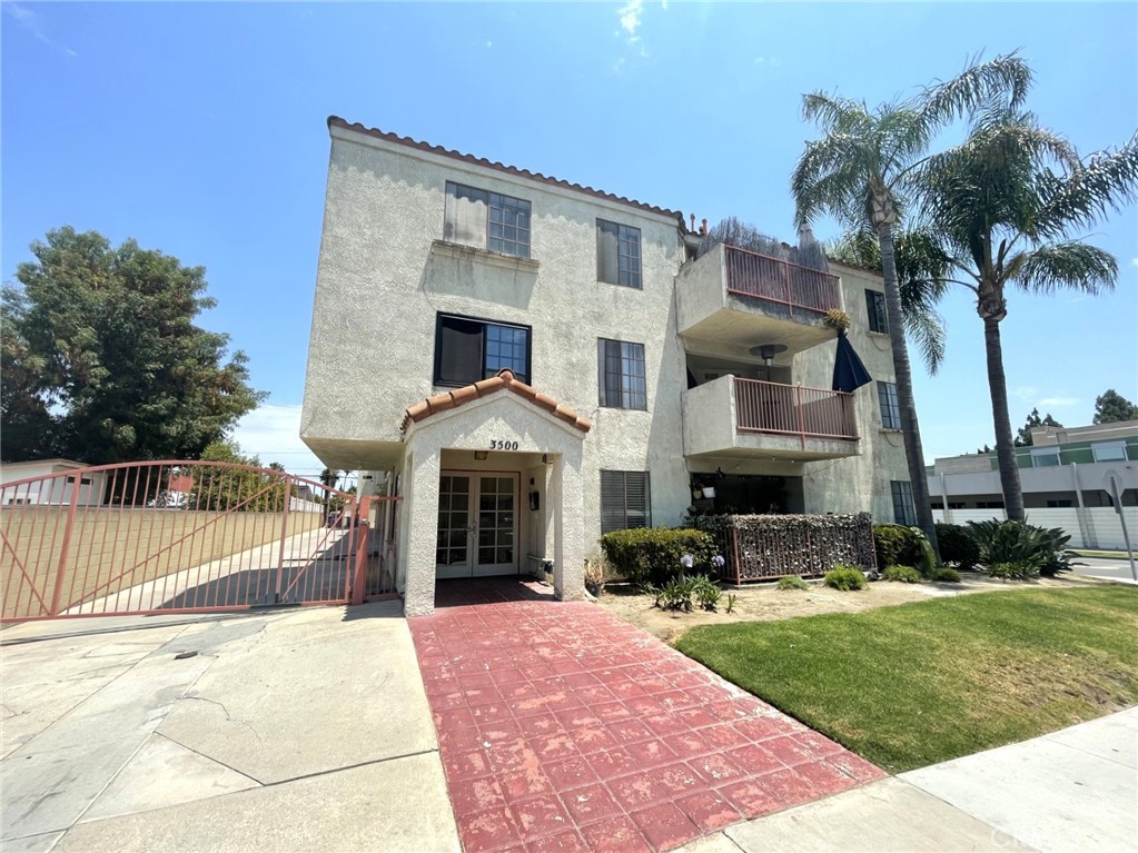 This wonderful condo features a trendy paint scheme which accents the unique design and many angles of the unit. With high vaulted ceilings, the unit seems larger than the already spacious 900 square feet. Large open living and dining areas are attached to a spacious kitchen and breakfast bar. The private master suite and bathroom are located on one side of the condo, and the other bedroom and bathroom are located across the hall on the other to create privacy. The large balcony overlooking Bixby Knolls from the 3rd floor features a great view and is perfect for late afternoon or weekend barbecues. Enjoy the convenience of a gated entry, gated parking, and on-site laundry facilities. This condo is located in the heart of Bixby Knolls and is walking distance to quaint shops, trendy cafes and several coffee houses. Located near Atlantic Ave. and Wardlow Rd.