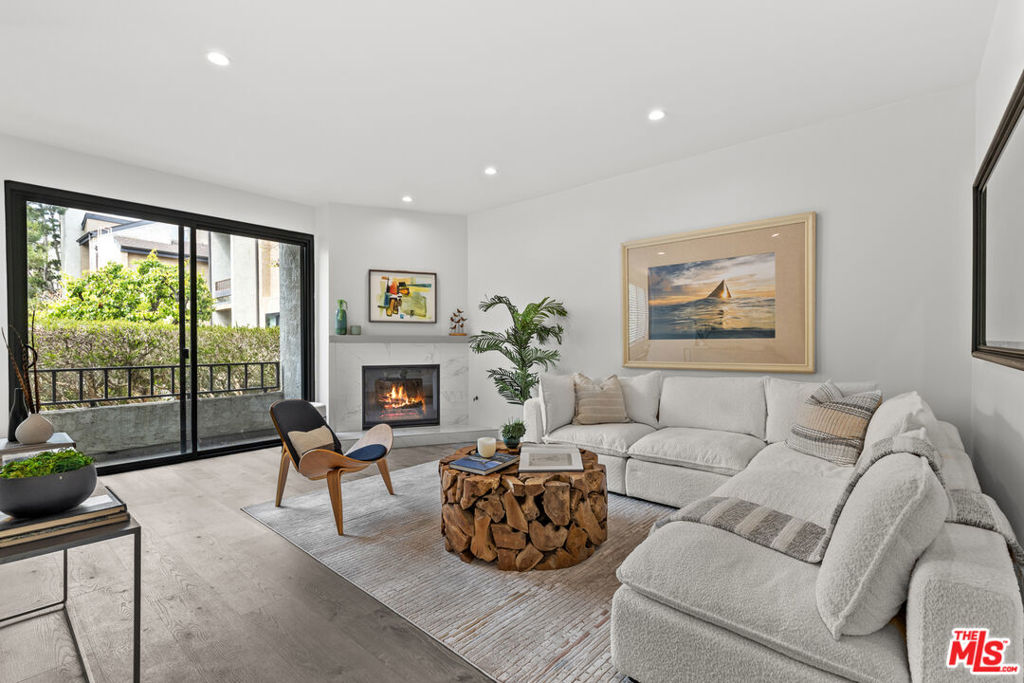 Extensively renovated 1 BD/ 1 BA condo with sleek, modern design. The main living space has incredible, natural light, gas fireplace and sliding doors that take you out to the unit's private balcony. Living room with recessed lights flows seamlessly into the kitchen; excellent for entertaining. Central AC and heat. Recently installed luxury vinyl plank floors throughout. The spacious bathroom includes a double vanity with excellent storage. Laundry in the unit. The bedroom includes a remote ceiling fan and cavernous reach-in closets with tall, sliding mirror doors. 2 tandem, gated parking spaces with additional storage. Complex amenities include tennis courts and pools accompanied by serene water features and meandering paths. Convenient access to the beach, Playa Vista, LMU, LAX, MDR and more!