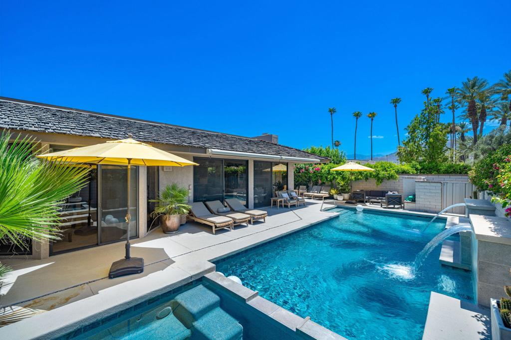 Discover the ultimate desert resort home with stunning views of the San Jacinto Mountains and a private pool and spa!This elegantly remodeled home is located within the sought-after Springs Country Club, centrally located in the heart of Rancho Mirage. Offering 3,088 square feet of refined living space, three bedrooms and three baths, this desert dream home embodies a seamless blend of style and comfort. The open Cypress Point floor plan effortlessly combines contemporary design with timeless indoor and outdoor entertaining spaces, creating an inviting ambiance perfect for a full-time residence or desert getaway. As you step inside, you'll be greeted by expansive living areas bathed in natural light, highlighting top-of-the-line finishes and exquisite attention to detail. The gourmet kitchen is a chef's dream, featuring state-of-the-art appliances, custom cabinetry, and a spacious island, perfect for culinary adventures and casual dining alike. The kitchen has been opened up to provide a seamless entertaining space with the living area. Adjoining living and dining areas are perfect for hosting gatherings or enjoying quiet evenings at home. Retreat to the luxurious primary suite, a tranquil haven complete with a spa-like bathroom and generous closet space. Two spacious guest bedrooms each with their own ensuite bathrooms and access to outdoor patios spaces offer comfort and privacy, ideal for family or visitors. 26 leased solar panels provide energy efficiency.Outside, the meticulously landscaped grounds provide a serene backdrop for outdoor living. Enjoy panoramic views of the stunning mountains while lounging by the pool or dining al fresco on the expansive patio. Residents of the Springs Country Club enjoy access to world-class amenities, including golf courses, tennis courts, and a state-of-the-art fitness center, all within a secure, gated community. Embrace the sophisticated lifestyle of Rancho Mirage in this exceptional home.