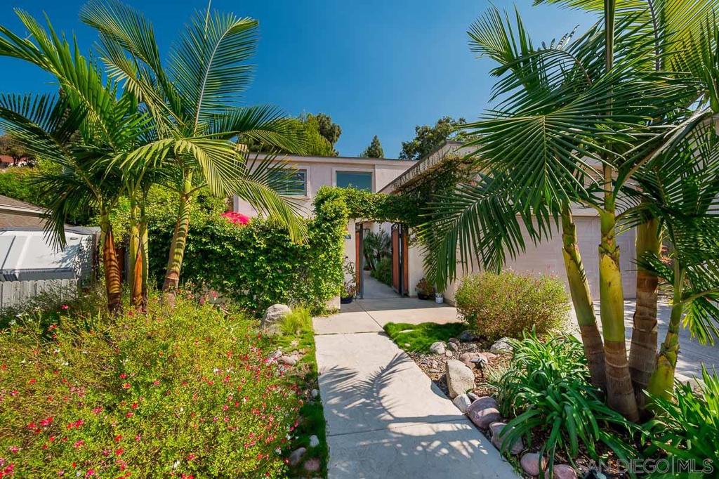 Rare find 5 bedroom home on 7,400 sq. ft. cul-de-sac lot. Awesome location walk to Mission Trials and Cowles Mountain. Modern court yard gated entrance w/firepit and cozy sitting area. Along with living area downstairs you will find 2 bedrooms and Jack and Jill bath. Upstairs- large main suite with enormous bath area, walk in closet and 2 more bedrooms and bath. Can't miss the large enclosed 30x10 patio w/wood burning stove. Outside enjoy a comfortable patio area and large grassy yard room for pool. Other Fees: 0 Sewer: Sewer Connected Topography: LL,