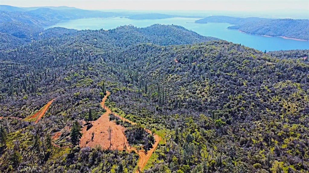 If you've been looking for that perfect property up in the mountains, LOOK NO FURTHER! You will be hard pressed to find another place that offers this much usable land, while still enjoying everything the mountains have to offer. Strategically cleared for optimum privacy and use, you'll find all the peace and tranquility you could ever want on this gorgeous 10 acres. The gently rolling topography lends multiple choices for further developing this very usable parcel, while still obtaining those priceless LAKE and SUNRISE/SUNSET VIEWS! The already cleared portion offers TONS of usable space and unbelievable views of Lake Oroville and the Valley below. Just a few minutes to the lake and a short drive to casinos, shopping, restaurants and more! These opportunities don't come along often...schedule your tour today!!