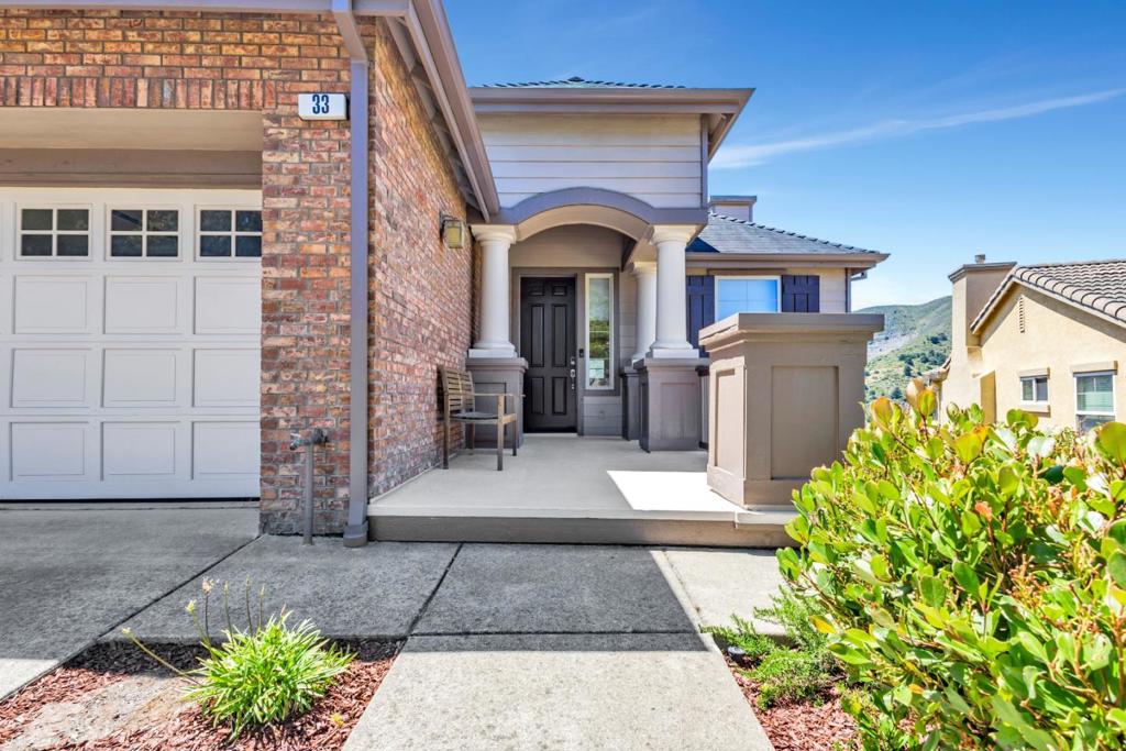 Experience breathtaking views of San Bruno Mountain and luxurious living in this stunning two-story Landmark at the Ridge home. Upon entering, youll be welcomed into a bright open floor plan, ideal for hosting elegant dinner parties or casual gatherings. Built in 2004, this desirable home offers roughly 2,830 sq ft, 4 bedrooms and 2.5 bathrooms. The main level features wide plank luxury vinyl flooring, recessed lights and a dining area that flows into the living room with a cozy gaslit fireplace, creating a warm ambiance on cool evenings. The gourmet eat-in kitchen is a chefs dream, boasting a center aisle with a 5-burner GE Monogram cooktop, sleek black granite counters, stainless steel appliances, maple cabinets, and expansive deck, great for al fresco dining. Adjacent to the kitchen is a family room with a gaslit fireplace, ideal for movie nights, a guest powder room and oversize 2-car garage with storage racks. The lower level boasts 4 bedrooms, including a huge primary suite with spectacular mountain views and sliding doors that open to the deck. A spa-like bathroom features dual vanity sinks, Jacuzzi tub, walk-in shower, walk-in closet, laundry room, hall bath & storage room. Close to SSF Biotech Firms, San Francisco, Silicon Valley, freeways, Caltrain, trails and more.