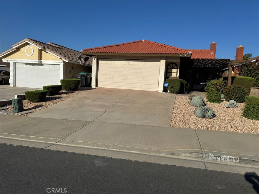 The quaint home is perfect for an individual or two people with two spacious bedrooms with the bathroom conveniently located between them.  On bedroom has direct access with its own door to the large soaker tub.  Two sliding glass windows look into the private backyard that is waiting for someone's personal touch.  Nice laminate flooring throughout the home provides easy cleanup for day to day living. A massive fireplace will keep you warm during the winter without using the central heating and will also be an accent piece for the living area.