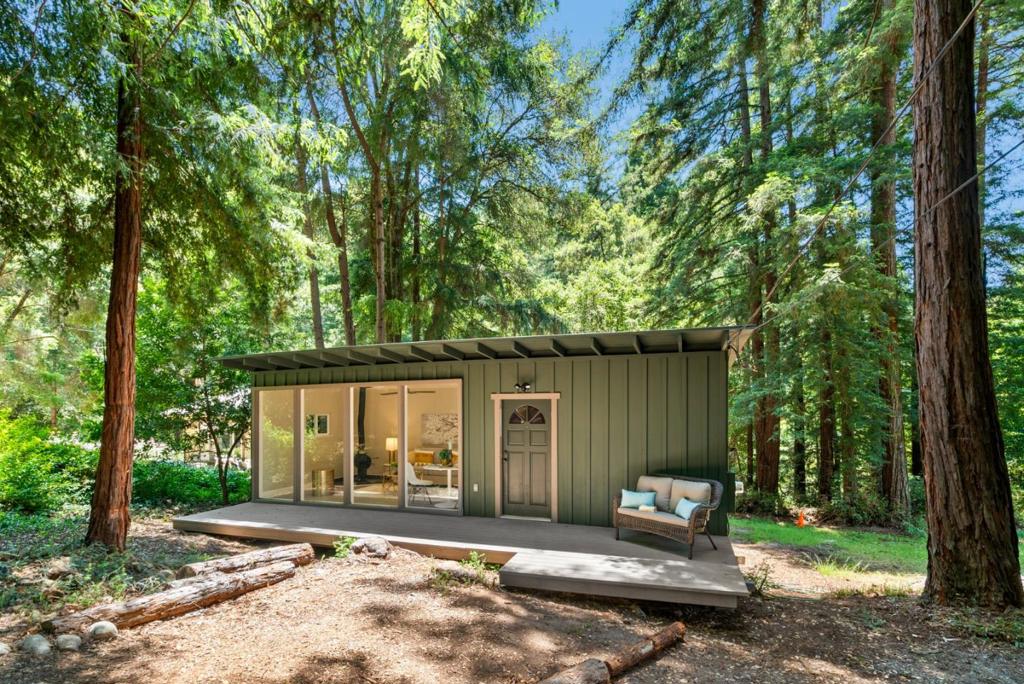 Welcome to 10840 Westwood Road - fall in love with this quaint, updated cabin nestled among the redwoods. This 1 bed, 1 bath woodsy retreat offers a living room with floor to ceiling windows, cozy wood stove and new kitchen with soft close cabinets, quartz countertops, subway tile backsplash, modern fixtures/hardware and new stainless steel oven range + refrigerator. Additional upgrades include wide plank laminate flooring, stylish light & plumbing fixtures, fresh paint, new bathroom vanity PLUS new front deck and 30-year roof. The site is perfect for a weekend getaway, full-time living or a peaceful vacation rental and offers a rare opportunity to enjoy serenity without sacrificing convenience. Just minutes from Downtown Felton, Loch Lomond Reservoir and Zayante Creek Market - it's the perfect mountain escape. Welcome Home!