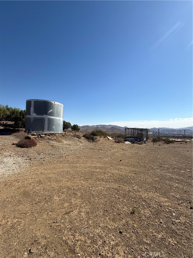 Experience breathtaking views from this 4.89-acre Acton hillside lot with a paved driveway leading directly to the property! This parcel offers two separate levels to build on, giving you flexibility for a custom home, ranch, or retreat. Take in the stunning mountain and valley panoramas while enjoying the privacy of nearly 5 acres. The lot includes its own private well, with electricity and sewage nearby, and is easily accessible from Hubbard Road. Zoned LCA21*, this rare opportunity combines convenience, usability, and some of the best views Acton has to offer. Buyer to perform all inspections and verify condition of water well.