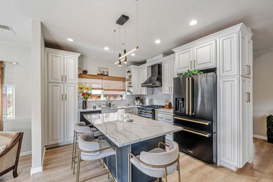 Nestled on a quiet cul-de-sac, this single-level, 4-bedroom, 3-bathroom residence was masterfully reimagined in 2024 with over $200,000 in high-end upgrades. The brand-new, light-filled interior boasts a stunning gourmet kitchen showcasing fully-upgraded Thomasville cabinetry, luxurious Cambria Quartz surfaces, premier ZLINE appliances, and a spacious center island. Stylish new flooring flows throughout, leading to thoughtfully redesigned bathrooms showcasing chic designer finishes. A standout feature is the expansive 11,074 sqft lot, rare blank canvas for your dream backyard oasis, with ample room for a pool, garden, or entertaining pavilion. This property offers significant potential to build a future ADU, perfect for a private guest house, home office, or for generating rental income. Enjoy a premier Silicon Valley location just minutes from the Dumbarton Bridge, providing an easy commute to Meta and other tech giants. You are also moments from premier shopping and dining at nearby NewPark Mall and Pacific Commons. This is a perfect blend of sophisticated modern living, lifestyle convenience, and future possibility.