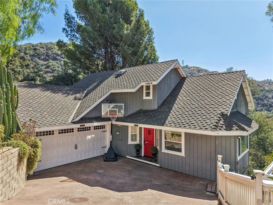 Exquisite Sherwood Forest location in Carbon Canyon, in the coveted Chino Hills area features stunning views and is situated on a 20,844 sqft lot! This three-story, custom home, has been updated and is ready for its new owners! Features include a custom red entry door, new kitchen and bathrooms, and a remodeled garage. The open floor plan showcases hardwood floors, crown moulding, custom door casings, wainscoting, and plantation shutters. The beautifully updated kitchen includes granite countertops, a center island with bar seating, trey ceiling, stainless steel appliances with included refrigerator, dishwasher, oven, and cooktop. The kitchen also features white cabinetry with soft close drawers. There is a 2nd breakfast bar between the kitchen and the spacious living room which offers vaulted ceilings a free-standing wood-burning stove fireplace and a large deck extends off the living room - the perfect space for relaxing, or entertaining guests! The primary bedroom includes a shiplap accent wall, gorgeous views, and built in organizers. The primary bath features a barn-door entry, dual sinks, a powder area, custom tile, and a full-size walk-in shower. There is also a main floor half bathroom for guests, as well as a laundry room with included washer and dryer. Upstairs you will find a loft area plus 2 secondary bedrooms and a bathroom with walk-in shower. The lower level apartment or guest space includes a living area plus kitchenette with brand-new stove, 1 bedroom and a full-size bathroom as well as private access to the outside. The attached, finished, Garage features vinyl flooring, wood panel ceiling with skylights, a large industrial style ceiling fan, included built-in cabinets and workbench, and the pool table is also included! The location offers a rural feel while still being close to schools, shopping, dining and more. There is also a large paved driveway, an additional carport with extra parking spaces, storage sheds, as well as decking that surrounds the home with many spaces to make your own. Ready for its next chapter, this home is the perfect place to create lasting memories. No HOA. Low tax rate. Do not miss this custom home!