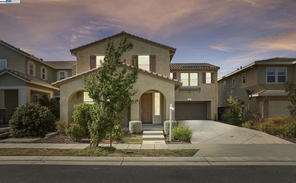 Welcome to this Exquisite BUILT IN 2017 4 BEDROOM, 3.5 BATHROOM, LOFT, 2 CAR GARAGE, SOLAR + CHARGING POINT EV CHARGER, COZY FIREPLACE single family home in HANSEN VILLAGE in MOUNTAIN HOUSE. The 1st floor comes with a bedroom & full bathroom perfect for hosting family & friends. The lavish living area gets plenty of natural light due to large windows and has a COZY FIREPLACE. The OPEN FLOOR PLAN seamlessly blends the gourmet KITCHEN, DINING AREA, & LIVING ROOM. The kitchen boasts a HUGE ISLAND, UPGRADED CABINETS WITH SOFT CLOSING, QUARTZ SLAB COUNTERTOPS, OVERSIZED ISLAND, WALK-IN PANTRY & HIGH END STAINLESS STEEL APPLIANCES. Upstairs features an EXTRA LARGE LOFT, 3 BEDROOMS, 2 BATHROOMS and a LAUNDRY ROOM. The primary bedroom comes with a luxurious en-suite featuring a LARGE SOAKING TUB, SEPARATE SHOWER, DUAL SINKS, AND A GENEROUS WALK-IN CLOSET. The SPACIOUS BACKYARD has a large CALIFORNIA ROOM with recessed lighting. It comes with a FENCED AREA to grow vegetables in & has a LAWN & SPRINKLER SYSTEM. It comes with a LONG DRIVEWAY where you can conveniently park 6 cars. You’ll have access to the TOP RATED Hansen K-8 School and walking distance to the award winning High School. EASY ACCESS TO GRANT LINE & 205 HIGHWAY. Don’t miss your opportunity to own this EXCEPTIONAL HOME!