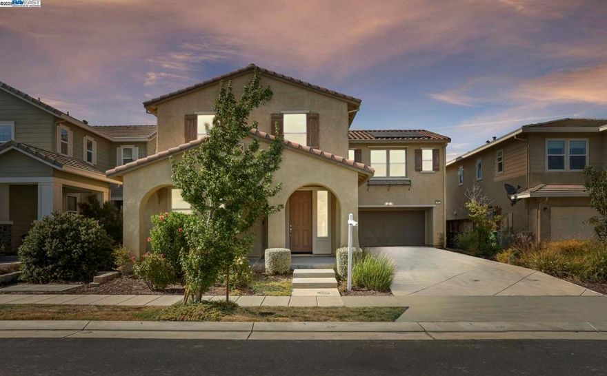 Welcome to this Exquisite BUILT IN 2017 4 BEDROOM, 3.5 BATHROOM, LOFT, 2 CAR GARAGE, SOLAR + CHARGING POINT EV CHARGER, COZY FIREPLACE single family home in HANSEN VILLAGE in MOUNTAIN HOUSE. The 1st floor comes with a bedroom & full bathroom perfect for hosting family & friends. The lavish living area gets plenty of natural light due to large windows and has a COZY FIREPLACE. The OPEN FLOOR PLAN seamlessly blends the gourmet KITCHEN, DINING AREA, & LIVING ROOM. The kitchen boasts a HUGE ISLAND, UPGRADED CABINETS WITH SOFT CLOSING, QUARTZ SLAB COUNTERTOPS, OVERSIZED ISLAND, WALK-IN PANTRY & HIGH END STAINLESS STEEL APPLIANCES. Upstairs features an EXTRA LARGE LOFT, 3 BEDROOMS, 2 BATHROOMS and a LAUNDRY ROOM. The primary bedroom comes with a luxurious en-suite featuring a LARGE SOAKING TUB, SEPARATE SHOWER, DUAL SINKS, AND A GENEROUS WALK-IN CLOSET. The SPACIOUS BACKYARD has a large CALIFORNIA ROOM with recessed lighting. It comes with a FENCED AREA to grow vegetables in & has a LAWN & SPRINKLER SYSTEM. It comes with a LONG DRIVEWAY where you can conveniently park 6 cars. You’ll have access to the TOP RATED Hansen K-8 School and walking distance to the award winning High School. EASY ACCESS TO GRANT LINE & 205 HIGHWAY. Don’t miss your opportunity to own this EXCEPTIONAL​​‌​​​​‌​​‌‌​​‌​​​‌‌​​​‌​​‌‌​​​‌​‌​​​‌‌​ HOME!