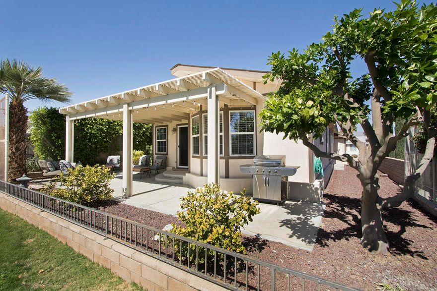 Announcing MAJOR price drop! Owners have returned to Canada permanently. Now available for tour daily 9 AM - 4 PM. Stunning views of the golf course and mountains from this beautiful south facing home located on the 5th fairway of Ivey Ranch CC golf course. Built in 2006it is over 1500 sq. ft with 3 bedrooms 2 bathrooms.The large covered fully furnished patio offers plenty of room for entertaining and relaxing; both slider and kitchen door open for easy access when grilling. Some furniture may be included.Master Bedroom with a large en suite bathroom and a walk in closet. Two additional bedrooms are spacious with close access to full hall bathroom.Granite counters with woodgrain cupboards in this roomy kitchen, direct access to dining area and opens to the living room. Vaulted ceiling, ceiling fans,includes updated appliances with separate laundry room.3 car attached garage easily holds 2 cars with a separate door for a golf cart.This home has a 433 Permanent Foundation for easy financing and you own the land. Ivey Ranch CC & GC, is a gated, senior community of manufactured homes integrated with a 9 hole golf course, Pro-shop, Driving Range, 4 community pools, exercise equipment room, tennis pickleball courts,  2 community spas, Club House and a Seasonal Restaurant. Many active socialclubs offer various activities.