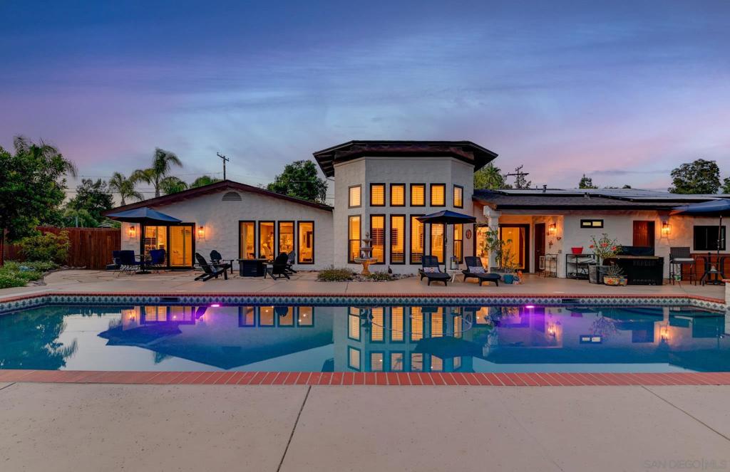 Welcome to this beautifully redesigned single-story home in the heart of Poway, where modern updates meet laid-back California living. Featuring 5 spacious bedrooms and 4 luxurious baths, this light-filled home offers an open floor plan designed for both comfort and connection. Wide-plank LVP flooring flows throughout, complementing the stylish kitchen and bathrooms finished with sleek, contemporary touches. Large windows and skylights fill the space with natural light, creating a warm, inviting atmosphere.  Step outside to your private backyard retreat complete with a sparkling saltwater pool, refreshed equipment, and a vibrant orchard of apple, lime, lemon, orange, guava, peach, avocado, and grapevines. Perfect for entertaining or enjoying peaceful moments in the sun. Enjoy leased solar to help keep energy costs low, so you can relax in both style and sustainability. This turnkey home delivers the ideal blend of style, upgrades, and outdoor charm all in the highly desirable Poway Unified School District.  Extensive upgrades include lifetime warranty windows (2023), a 50-year roof (2022), skylights (2022), interior and exterior paint with a 5-year warranty (2022), full home plumbing re-pipe (2022–2023), two AC units, two furnaces, tankless water heater, and water softener (all 2022), plus saltwater pool conversion and equipment refresh (2023). This is Poway living at its finest move-in ready and made for the good life. Don’t miss it!