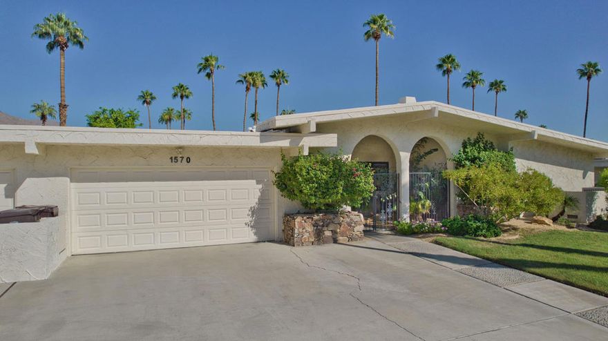 HUGE stately condo in PRIME South Palm Springs location. A very fresh and beautifully updated classic offers dramatic architecture, BIG mountain and greenbelt / pool views, 2 large bedrooms with ensuite baths, a LARGE den for overflow guests and access to a 3rd bath with shower. SWANKY sunken bar for entertaining, generous dining room AND large kitchen fitted with all the amenities. Laundry room! Oversized 2 car garage with NEW extra refrigerator. Entry courtyard, VERY LARGE back patio so you can relax and enjoy the stunning views. SO close to shopping (Smoke Tree) and restaurants. 3 minutes to Indian Canyons Golf courses or hiking. 6 or 7 minutes to downtown or PS airport. FIRST TIME available for seasonal rent!!  This one is an A+