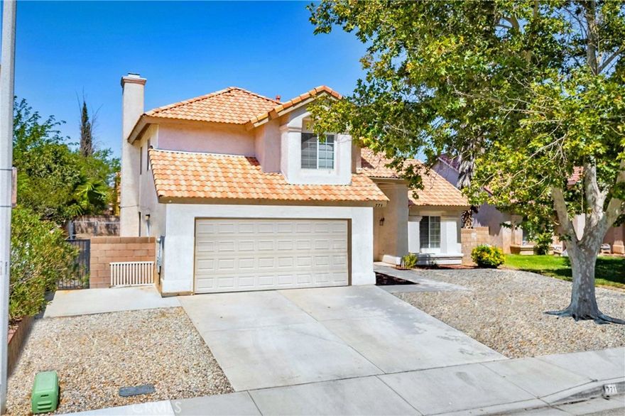 SECTION 8/HOUSING VOUCHER APPLICANTS ENCOURAGED TO APPLY | Welcome to 771 E Avenue K-7, Lancaster, CA — a well-maintained two-story home offering 4 bedrooms, 3 bathrooms, and nearly 2,000 sq. ft. of functional living space. Located on a quiet residential street, this property is designed for everyday comfort and versatility. Inside, you'll find a bright and open layout featuring vaulted ceilings in the living room, a formal dining area, and a cozy family room with fireplace. The updated kitchen includes quartz countertops, ample cabinetry, and a breakfast nook—ideal for casual meals or morning routines. A standout feature is the enclosed sunroom, offering flexible space for entertaining, hobbies, or simply enjoying natural light throughout the year. Upstairs, the spacious primary suite includes an en-suite bath and generous closet space. Three additional bedrooms and a full bathroom provide room for family, guests, or remote work setups. A half bath is conveniently located on the main floor. The fenced backyard is ready for outdoor activities, while the attached 2-car garage, dedicated laundry room, and central heating & A/C add everyday convenience. With close proximity to schools, shopping, dining, and freeway access, this home delivers space, comfort, and accessibility in one complete package.
