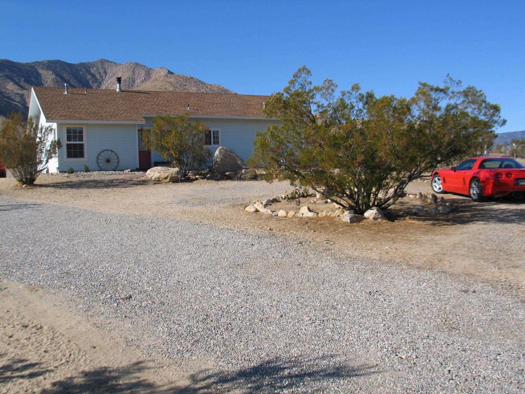 Clean and Bright home. Lovingly cared for. 3 bedroom 2 full bath, open floor plan. New Quartz counters and Back Splash to be installed soon. Home is on one level fenced acre. Multiple outbuildings, including a meditation building and a Covered carport. There is a well on this property. Leased Solar panels, lease is transferable, Sunrun. Buyer to purchase Sunrun Lease.