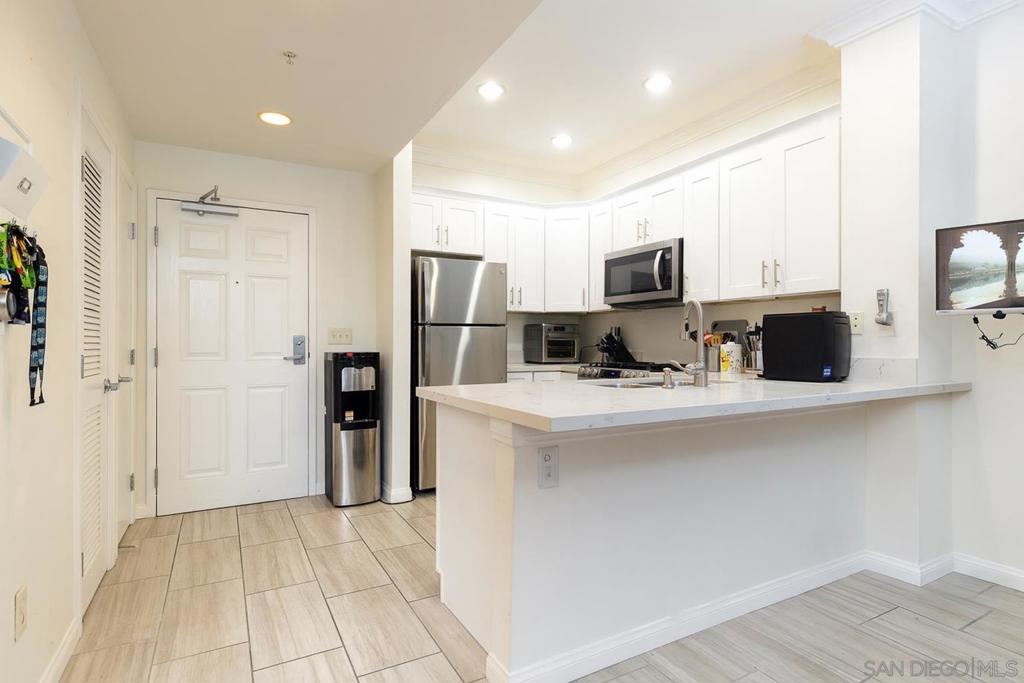 Bright, south-facing condo in the heart of San Diego’s Gaslamp Quarter at 450 J Street, on the same level as the pool, BBQ, gym, and fitness center, this home offers easy access to resort-style amenities. Secure underground parking and a gated community. Perfect as a stylish downtown residence or lock-and-leave second home, you’ll be steps from world-class dining, nightlife, Petco Park, the waterfront, and year-round events. Experience the vibrant energy of the Gaslamp while enjoying the comfort and convenience of modern city living.