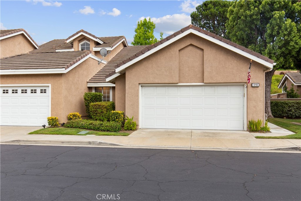 Move-in ready single-story home — all appliances included (fridge, washer, and dryer)! This 3-bedroom, 2-bath home offers 1,400 sqft of living space, hard flooring throughout (no carpet), and a 2-car garage with plenty of storage. Located in the hills of Anaheim, the property is available furnished or unfurnished. Enjoy a private wraparound patio with direct access from the primary suite, dining area, and main entry. Features include custom hardscape, built-in brick seating, string lights, lush landscaping, and no rear neighbors — just open hillside for added privacy and a tucked-away feel. Situated on a quiet cul-de-sac in a safe and peaceful neighborhood with scenic views. The HOA covers front yard maintenance, and the community offers a pool, spa, and guest parking.