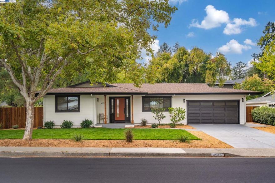 Welcome to a reimagined Walnut Creek residence where timeless character meets modern California living. Thoughtfully redesigned, this single-level home sits on a generous flat corner lot in one of the area’s most desirable neighborhoods. Light-filled living spaces feature wide-plank oak flooring, recessed lighting, and a cohesive modern aesthetic. The chef’s kitchen impresses with sleek white cabinetry, rich soapstone countertops, and high-end appliances. The primary suite offers a custom walk-in closet and a beautifully finished bath, while additional bedrooms provide versatility for family or guests. A detached office in the backyard mirrors the home’s design, offering the perfect space for remote work or creative pursuits. Outdoors, brand-new redwood fencing, fresh sod, and a custom pergola create an inviting setting for entertaining or relaxation. Conveniently located near Palos Verdes Shopping Center, top-rated schools, parks, trails, and freeway access.