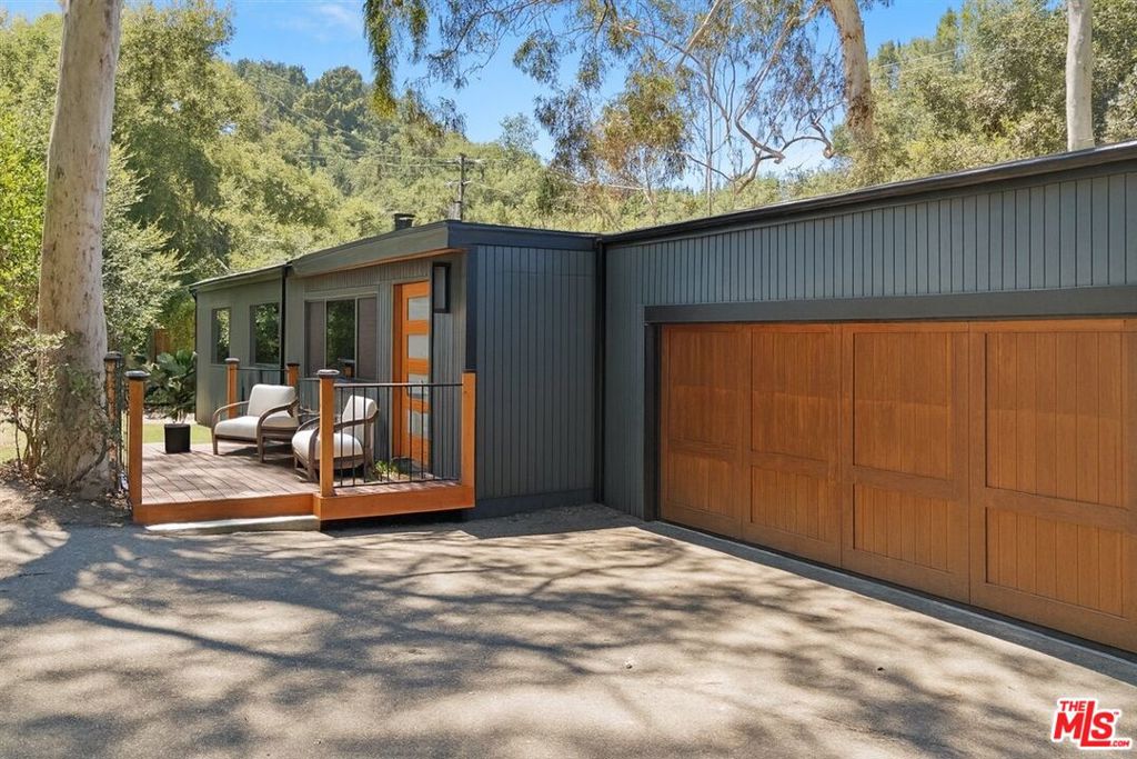JUST COMPLETED! There are no better words when buying a new home, than 'turn-key'. Located in the heart of the highly-demanded Topanga community, drive down your private driveway and step into this significantly renovated oasis of Topanga lifestyle. Upon entry be greeted with gorgeous natural light and an open and spacious floor-plan with the kitchen being designed for the Chef that loves to entertain, with beautiful stainless steel appliances including a 6-burner stovetop along with a spacious 'living room facing' island that includes the microwave for convenience. Not to mention some of the many upgrades completed for this home, from custom cabinets, stone countertops, sinks and fixtures, remodeled bathrooms, new engineered hardwood flooring, new exterior decks and railings, exterior siding, paint, resurfaced driveway, new garage door, brand-new water heater, and more! This 3+2 gem truly boasts everything Topanga is known for with its privacy and serenity. Step outside onto your decks and patios surrounded by lush landscape with a stunning canopy of trees, and plenty of flat area on this almost half an acre lot to expand your value with plenty of space for an ADU and/or swimming pool and spa. One of the most desirable areas very close to Topanga Village, hiking trails and only a 15 minute drive to the beautiful beaches of Malibu!
