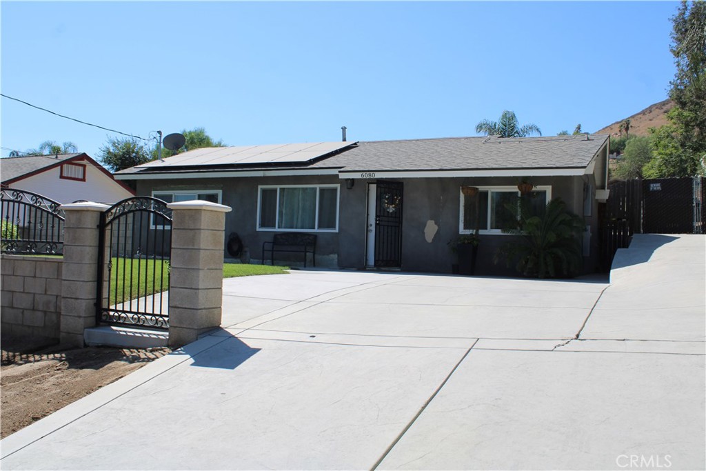 Welcome to 6080 Barcelona Ave in Jurupa Valley, a charming property offering comfort, upgrades, and versatility. This well-maintained home features 2 bedrooms, 1 bathroom, plus a bonus bathroom, making it an excellent fit for families or anyone seeking extra space. The upgraded kitchen is a true highlight, complete with stainless steel appliances, modern countertops, stylish backsplash, modern cabinetry, recessed lighting, and upgraded windows. The home also boasts beautiful tile flooring, fresh interior paint, and a cemented driveway for added convenience. Major improvements include upgraded plumbing and electrical systems, central air and heating, a newer roof, and leased solar panels for energy efficiency. The property also offers RV parking access, trailer hookups, and a cemented backyard for low-maintenance living. Enjoy the large backyard with plenty of fruit trees, perfect for family gatherings, while the property’s horse zoning provides additional possibilities. A block fence adds security and privacy, and the landscaped front and back yards complete the picture. Located just minutes from the 60 Freeway, this home combines comfort, functionality, and convenience in one great package.