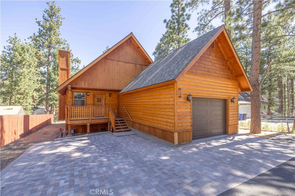 2024 Mountain Modern Meets Rustic Charm! Welcome to your dream retreat nestled in the pines! This stunning log-style home offers the perfect blend of rustic charm and modern elegance. The updated kitchen features sleek white cabinetry, luxurious quartz countertops, and brand new stainless steel appliances ready for all your mountain meals and cozy gatherings. With 4 spacious bedrooms, a large bonus loft, and 3 beautifully designed bathrooms featuring modern tile and stylish fixtures, there’s room for everyone to relax in comfort. A gas rock fireplace serves as the heart of the home—ideal for snowy evenings and quiet mornings. Step outside and enjoy the serenity of the forest, tucked away on a peaceful street just steps from scenic open trails, yet only minutes from all the excitement Big Bear has to offer. Less than 10 minutes away from the lake, schools and shopping centers. Make this home ideal as a primary residence, weekend getaway, or high-demand short-term rental.
