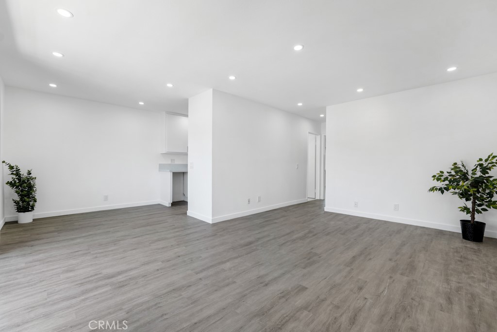 Welcome to this charming 1 bedroom1 bathroom corner top-floor unit in Canoga Park. Recently upgraded with modern recessed lighting, fresh laminate flooring, and a stylish quartz countertop, this home also features a newly installed split AC unit for year-round comfort. Enjoy your morning coffee on the lovely balcony and take in the serene surroundings. Benefit from a private parking spot with no adjacent vehicles, offering a unique sense of privacy. Additionally, this unit boasts low HOA dues and is situated in a prime location in Canoga Park, making it an even more attractive choice. This cozy retreat is perfect for those seeking comfort and convenience.