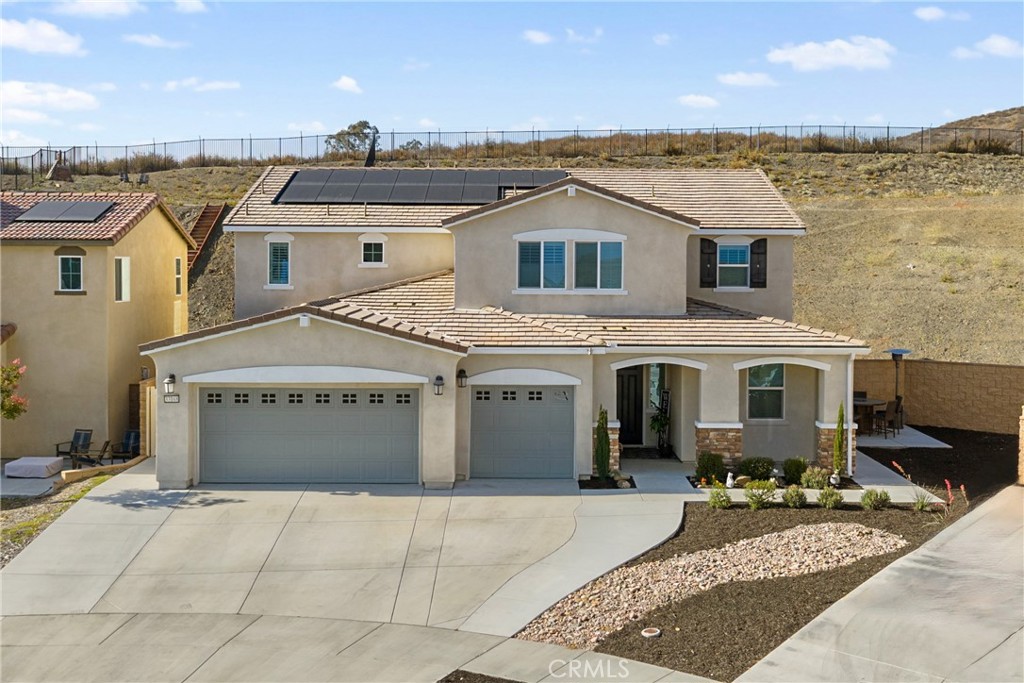 Don't miss this STUNNING EXECUTIVE LENNAR NEXT GEN/ADU home nestled in the rapidly growing area of Winchester, situated at the end of a serene cul-de-sac. The NEXT GEN/ADU has its own entrance with 1 bedroom/1 bath, PLUS an ATTACHED SUITE that could easily be turned into 2ND bedroom offering approximately 900 square feet of luxurious living space. With its own separate entrance and private yard, this ADU is PERFECT for generating rental income or accommodating aging parents, providing them with independence and comfort. As you step inside, you'll be greeted by a fully upgraded interior that exudes sophistication and style. The main level features AN ENORMOUS GREAT ROOM with elegant white porcelain tile flooring flowing seamlessly throughout the open-concept design. The kitchen is truly A CHEF'S dream, showcasing an OVERSIZED quartz island that is both MASSIVE AND inviting, making it ideal for casual dining BUT PERFECT FOR entertaining. The upgraded appliances will satisfy even the most discerning culinary enthusiasts, ensuring that meal preparation is a delight. A lovely FIREPLACE is placed perfectly in the corner and ads to the elegance of the GREAT room. The GREAT room ALSO INCLUDES a generous dining area ensuring you are ready to host large gatherings with family and friends.
Upstairs, you’ll discover four generously sized bedrooms, complemented by a spacious LOFT/FAMILY ROOM area that can serve as a playroom, media room, or additional living space. The primary bedroom is at the left wing and is a TRUE RETREAT, featuring a LUXURIOUS ensuite bathroom WITH AN INCREDIBLE WALK IN CLOSET and a LARGE versatile suite that is perfect for a nursery, OR home office. Each bedroom is thoughtfully designed with plenty of natural light and comfort in mind. GUEST BATH UPSTAIRS FEATURES ONE BATHROOM with 2 SINK VANITY AND BOOK ENDS SEPARATE TOILET AND SHOWERS ON EACH SIDE! Upstairs laundry is PAST generous in size and offers plenty of cabinetry!
Step out to your rear yard and imagine the hundreds of possibilities! Right back corner offers space for a pool while the flat area at top of slope offers incredible views and could easily accommodate a gazebo. NO upgrade has been spared in this exquisite home, ensuring that every detail meets the highest standards of modern living.
Don’t miss your OPPORTUNITY to own this exceptional home in Winchester – where luxury, convenience, and comfort meet!
* Home interior/exterior has been digitally staged to show potential*
