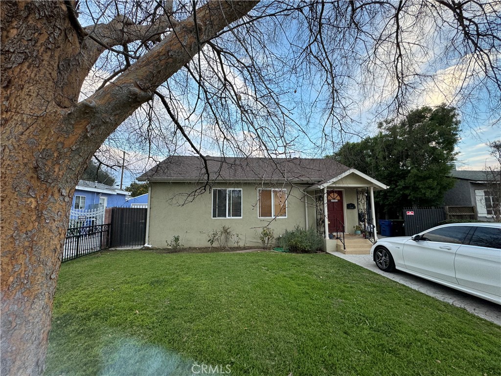 This beautiful 3-bedroom, 2-bath home in the Sherman Oaks adjacent neighborhood offers a luxurious living experience. The oversized Master Suite boasts a double vanity, walk-in closet, and French door access to the spacious and enclosed backyard with an Orange Tree, perfect for entertaining. Hardwood floors flow throughout the residence, creating a timeless and elegant atmosphere. The home features a laundry room for added convenience. A dining room and attached living room provide both formal and casual spaces. The large second bathroom includes a tub/shower and double vanity. Tandem parking on driveway. Left side for main house. Right side for separate guest unit (ADU garage conversion). ADU has tenant. Separate yard and entry for each property. The property's prime location provides close access to Kester Elementary, Ralphs, CVS, restaurants on the boulevard, and the 101 freeway, making it a desirable and convenient place to call home.