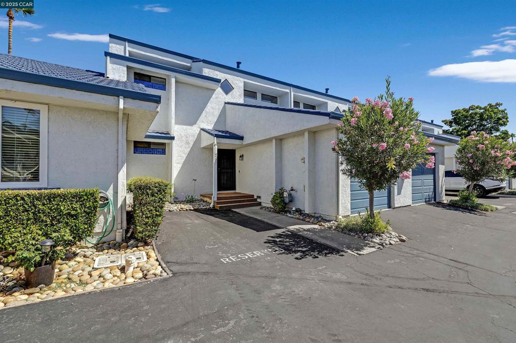 Wake up to water views in this beautifully remodeled Discovery Bay home, where every day feels like a vacation. With 2 bedrooms, 2 baths, and a versatile loft perfect for a third bedroom, this light-filled home features vaulted ceilings, luxury plank flooring, a cozy fireplace with and striking designer tile. The sleek kitchen boasts quartz countertops, stainless steel appliances, recessed lighting and a breakfast bar—ideal for casual mornings before stepping out to the balcony or deck to watch boats pass by. The primary suite offers peaceful views of the Delta, while the updated baths, stacking washer/dryer, ceiling fans, and new epoxy garage floor add convenience and style. Located in the sought-after Harbor Bay HOA, residents enjoy a pool, walking paths, and the unbeatable Delta lifestyle. Take the scenic water path to the Marina, Yacht Club, or Marina Bar & Grill—just a 7-minute stroll away—for sunset dinners, live music, or boating adventures. Life in Discovery Bay is relaxed, social, and centered around the water. Come live where others vacation.
