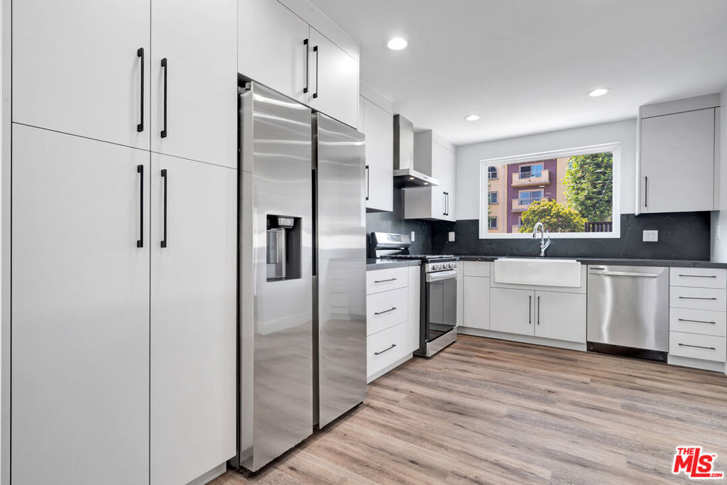 Absolutely stunning and spacious 3br/3ba unit in a small 5 unit complex. Newly built, well appointed, and spacious unit features a massive first level great room with beautifully marbled kitchen island countertop, ample modern cabinets and new stainless steel refrigerator, stove, and dishwasher, Oversized undermount sink, modern multi unit central AC and heat and modern decorative and functional fireplace unit. There is a bathroom on the main level with floating vanity and washer dryer. The unit is modern, spacious and well located close to freeways, shopping and convenient to all areas of the City. Upstairs you will find three spacious bedrooms each stunning in size, getting brilliant natural light. The primary bedroom has cathedral ceilings and the bathrooms are sleek, modern and spacious with rain head showers and contemporary tile work. Hardwood floors throughout. Be the first to live in this meticulously finished, modern home. Front unit is stand alone with no shared walls. Welcome! Your new home awaits. All occupants over 18 must complete an application. One year lease to begin. Tenats pay all utilities except water. Available for immediate move in.