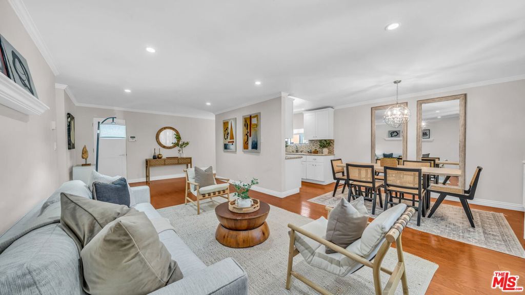 Remodeled contemporary single-level condominium in the coveted South of Montana/North of Wilshire neighborhood. Well-positioned front-facing location with minimal common walls for privacy. Nicely proportioned bedrooms with two full baths. Large outdoor balcony lined by a colonnade of trees for privacy. Stone counters, stainless appliances, designer fixtures and finishes, engineered wood floors. Everyday living made easy with gated, secure building, two parking spaces & extra storage.