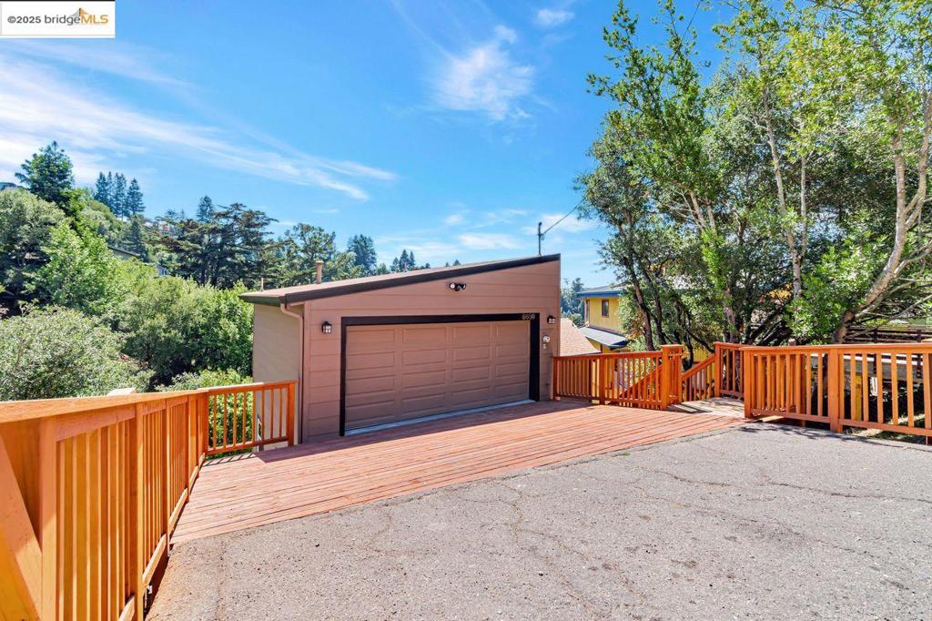 Spacious, Stylish, & Sun-Soaked—A Creekside Contemporary w/Bay Views transparently priced! Discover refined comfort & elevated design in this beautifully updated 4-bedroom, 3-bath home nestled in the verdant Montclair Hills. With approximately 2,693 square feet of light-filled living space, this home offers a striking balance of privacy, scale, & natural beauty. Step inside to find soaring ceilings that open up the living & dining areas, creating a dramatic & airy ambiance. All-new exterior doors and windows frame glimpses of the North Bay and lush greenery, inviting nature & sunlight into every room. New carpeting throughout adds a soft, modern touch to the already warm and welcoming interior. Whether you're enjoying a peaceful moment on the deck or entertaining in the spacious great room, you'll appreciate the home's partial peek-a-boo views of the Bay, along with its sunny southwestern exposure—ideal for afternoon light and golden sunsets. Set along a seasonal creekside setting, this property delivers a rare combination: a tranquil, almost woodland vibe, yet just minutes from Montclair Village shops, cafés, & top-rated schools. Key Features: All new exterior doors and windows, New carpeting throughout, Vaulted ceilings on the main, Peek-a-boo North Bay views,Creekside setting.