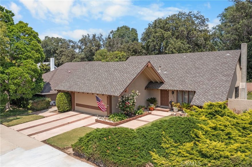 This beautiful 4-bedroom, 2-bathroom home offers a rare opportunity to own a solid property in one of Santa Ana's most peaceful and desirable neighborhoods. Owned by the same family since it was originally built, the home has been thoughtfully cared for over the years and remains in excellent condition—though its interior reflects its original era and is ready for a modern update. The home features newer carpet, a spacious living area, and a functional layout. Outside, enjoy a large backyard with a covered patio awning—ideal for entertaining or creating a custom outdoor retreat. There's plenty of space for gardening and pets. The front lawn and long driveway lead to a 2-car garage, offering ample parking and curb appeal. Perfectly situated just a 2-minute walk from Portola Park and under 10 minutes by car to Main Place Mall, the home is also within a short distance to Hart Park, the Santiago Creek Trail, and the historic Circle of Orange with its charming restaurants and vintage shops. Nearby elementary and middle schools add to the property's appeal for families. This is a great opportunity for buyers looking to renovate a home with strong bones in a great location.