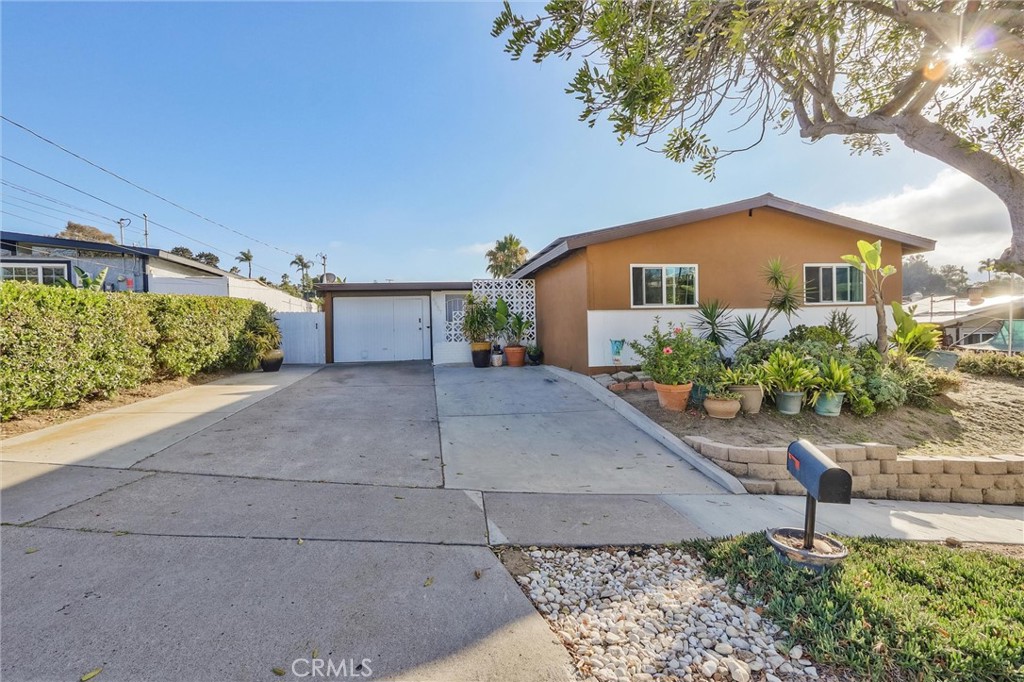 Charming single-story home located in the heart of Clairemont Mesa East, and only 6 miles to the beach! Offering 3 bedrooms, 1 bathroom, and 1,018 square feet of upgraded living space on a generous 6,400 square foot lot, plenty of space for an ADU! This thoughtfully improved mid-century home features a functional single-level layout with modern touches, energy-efficient systems, and a peaceful backyard retreat.
Step inside to discover updated flooring, fresh lighting, and a bright, open living space that flows into the dining area and kitchen. The kitchen has been tastefully remodeled with newer cabinetry, granite countertops, and a matching granite backsplash, offering plenty of prep space and a clean, modern look. A newer sliding glass door brings in natural light and leads directly to the backyard, perfect for indoor-outdoor living.
All three bedrooms are well-sized and feature mini-split A/C and heating units, allowing for personalized climate control in each room. The living area also includes its own mini-split, offering efficient and space-conscious comfort throughout the home. The full bathroom has been updated with new counters, cabinets and clean hardware finishes, completing the home’s cohesive, refreshed interior.
Additional upgrades include dual-pane windows and sliding doors for energy efficiency and noise reduction, a newer tankless water heater, a newer roof, and a fully paid solar system paired with an upgraded electrical panel, offering long-term utility savings and peace of mind.
Outside, the backyard offers a tranquil setting with a concrete patio area, jacuzzi spa, and low-maintenance landscaping—perfect for entertaining, relaxing, or future personalization. An oversized one-car garage and wide driveway provide ample parking and storage.
Situated near the 805 and 163 freeways, this home offers quick access to all parts of San Diego. Local conveniences include shopping, restaurants, and parks, and schools. Tucked away on a quiet, residential cul-de-sac with sidewalks and streetlights, this home is a rare combination of charm, comfort, and convenience in one of San Diego’s most well known areas!