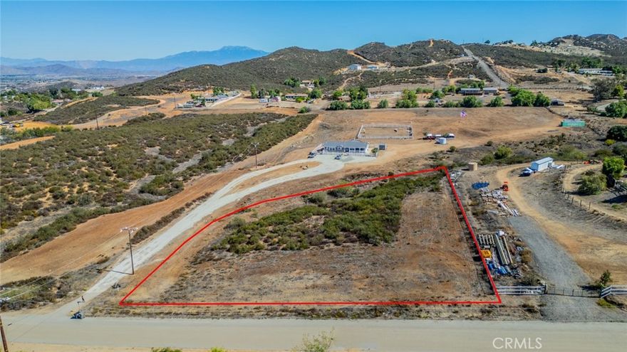 Exceptional Opportunity in the Growing City of Menifee
Discover a rare opportunity to own approximately 2.5 acres of land in the rapidly expanding City of Menifee—your own serene retreat with endless potential. Ideally situated between the I-15 and I-215 freeways off Bundy Road, this property offers both accessibility and tranquility.
While the parcel will require the installation of a private well, propane, and septic system, access to electricity should not present an issue, as a power pole is conveniently located adjacent to the lot. The site is well-suited for a custom-built residence or a manufactured home, providing a versatile canvas for your architectural vision.
The expansive lot offers ample space to accommodate an additional dwelling unit (ADU), barn, pool, workshop, or other structures to suit your lifestyle. The surrounding community features a harmonious blend of rural living and entrepreneurial spirit, where residents enjoy peaceful surroundings while operating construction and other home-based businesses.
Buyer to verify all information to their own satisfaction. Listing Agent and Broker make no representations or warranties regarding the accuracy of the square footage, lot size, dimensions, zoning, utilities, or other property features. Buyer is strongly advised to conduct independent due diligence, including verification through appropriate professionals and agencies.