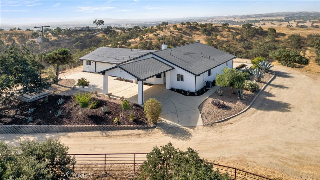 Experience the very best views Paso Robles has to offer at this remarkable 10-acre hilltop retreat. Perfectly situated at the top of a ridge, this private estate captures breathtaking 360-degree vistas of rolling vineyards, oak-studded hillsides, and the surrounding wine country.
Recently refreshed with new interior and exterior paint, the home features a beautifully upgraded kitchen with generous storage and modern finishes, creating an inviting space for cooking and entertaining. The floor plan flows seamlessly, offering comfort for everyday family living while also making an ideal setup for a vacation rental. In fact, this property has been a successful short-term rental for the past year, giving buyers flexibility for either private enjoyment or continued income potential.
The den exudes warmth with its cozy wood stove, while a private laundry room and multiple-car garage add to the home’s functionality. Step outside to the spacious covered patio—perfect for gatherings, summer evenings, or simply relaxing while taking in the endless views. The property is fully fenced, offering peace of mind and the tranquility of country living. The property feature many new and fresh upgrades including rebuilt septic system and landscaping improvements.
Whether you’re searching for a serene family home, a weekend getaway, or a proven income-producing property, 7090 Rancho Verano delivers unmatched Paso Robles charm with panoramic beauty and modern convenience.