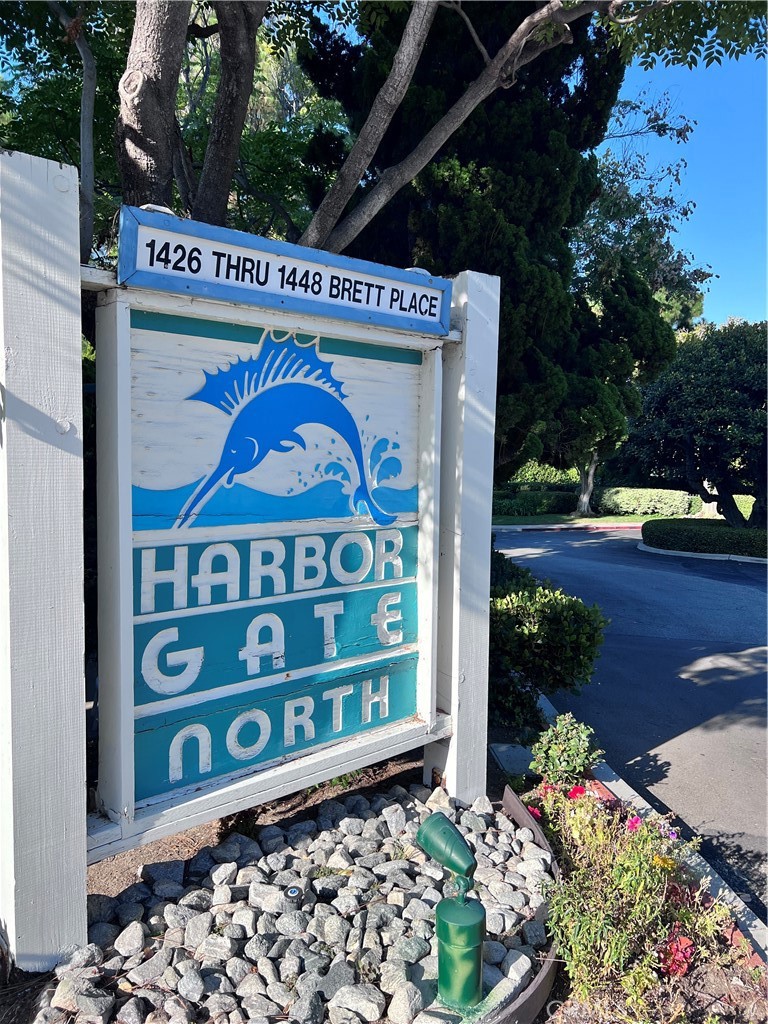 Convenient and Highly desirable Harbor Gate North Complex, Floor level entry AND a Private tandem 2 car garage. This premiere Complex offers a gated and ample swimming pool, separate Jaccuzzi and a wide cascade surrounded by mature Pine and Eucalyptus trees and other varieties of shady and oxygen emitting trees and lush plants regularly and professionally maintained. The unit is cozy with large sliding doors leading to an oversized patio extended from the living room and the bedroom, flooring appears to be hardwood, buyers to verify, gas and wood burning fireplace, kitchenette with nice cabinetry and breakfast nook showered with natural light through a dining area window. as you approach the full bath, there is a stack up washer and dryer, HVAC/Central heating. Your 2 CAR GARAGE is just a few yards away, guest parking outside the gated complex with a convenient security gate. This is a valuable opportunity to live in a secured and quiet Complex.Special Assessment ($32,999-$297/mo.) for exterior repairs actively in the complex to be paid by the sellers at close of escrow.