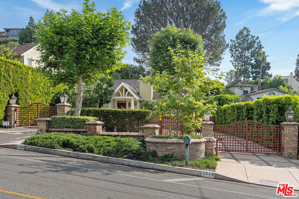 Prime lower Doheny! Bright, open and airy 3 bedroom, 3.5 bathroom updated Country English home features impressive materials from travertine tile work to custom Paul Ferrante light fixtures, elegant vaulted ceilings and exquisite design. No details have been overlooked throughout, highlighting a large living room with fireplace, built-in bookshelves and french doors leading to outdoor living spaces, formal dining room, chef's kitchen with custom cabinets, viking stainless steel appliances, and laundry closet. Central heating and AC. Dimmable LED lighting throughout. Enchanting primary suite reveals exposed beams, vaulted ceilings, large walk-in-closet &dramatic spa-like primary bath. Lush oasis-like backyard exudes privacy, a gorgeous pool and deck, a perfect space for entertaining. Circular entry/exit double gated, over-sized driveway adds to the impressive curb appeal of this home situated on an expansive street-to-street lot. Lower Doheny is one of the most sought after locations, moments from world famous entertainment, dining, fashion, design, and nightlife venues in the greater Los Angeles.