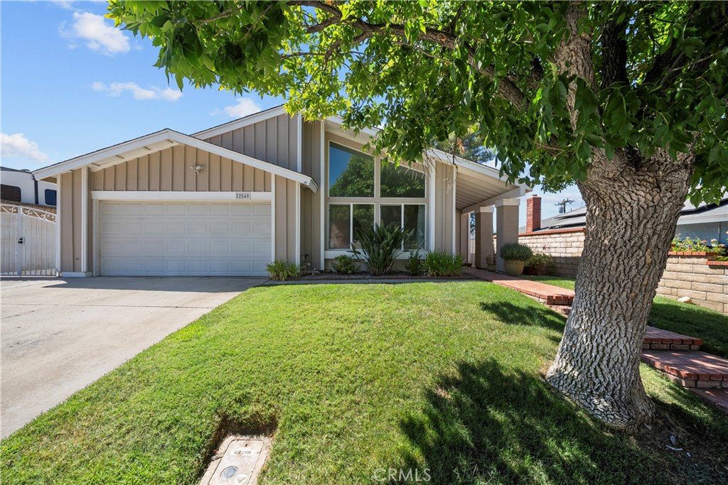 Welcome to this charming 4-bedroom, 2-bathroom home with RV parking! As you enter, you'll be greeted by soaring vaulted ceilings and expansive windows in the spacious living room. The beautifully remodeled kitchen overlooks the cozy family room, complete with a fireplace, and the adjacent dining area. Throughout the home, you'll find stylish wood like flooring, which flows seamlessly into the hallway leading to all four bedrooms. The guest bathroom features a sleek tiled walk-in shower. The master bedroom offers direct access to the backyard, creating a seamless transition between indoor and outdoor living. Outside, the private backyard offers a covered patio and a generous grassy area—perfect for relaxing or entertaining. Located in a highly sought-after neighborhood, this home is within walking distance of a park, junior high, and elementary schools. No HOA or Mello Roos.