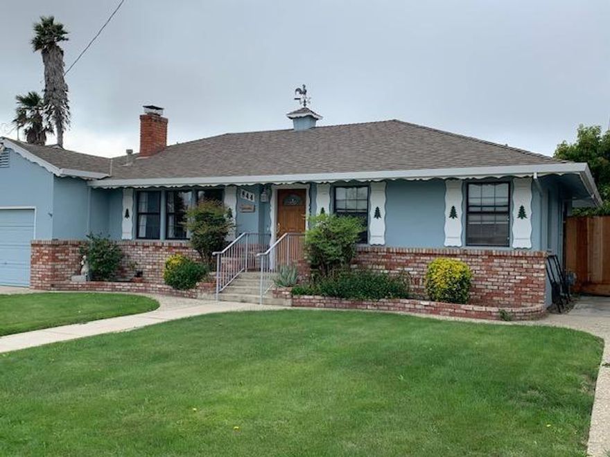Must see it soon! Family convenience in this  3-bedroom, 1.5 bathroom cottage style home in the heart of South Salinas. With 1,732 square feet of living space on a 6,500 square foot lot there is room for all your favorite activities. The kitchen is well-equipped with tile countertops, a dishwasher, exhaust fan over the gas range, refrigerator, in a functional u-shape space. The home features beautiful, refinished original hardwood flooring throughout. The single car garage is filled with storage and the laundry area. Outdoor living is ready for your barbecue party. Clean and quiet neighborhood. Walk to Palma Private School, Hartnell Jr College, and Oldtown Salinas. The hospital and medical offices are close too. This is your hub for life choices.   The family room, which combines with the kitchen, offers a cozy dining area, perfect for family gatherings. Enjoy evenings by the fireplace under high, open beam ceilings, adding character and charm to the living space. Practical amenities include central forced air gas heating and laundry facilities conveniently located in the garage, complete with a washer and dryer. This home falls under the Salinas City Elementary School District. With a single-car garage, this property is a must-see for anyone looking to settle in Salinas.