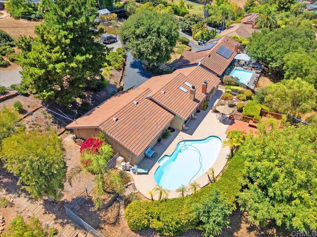 2073 Mountain View Drive – Escondido, CA 92027 Tucked away at the end of a private drive, this hidden gem offers the perfect blend of privacy, potential, and quintessential Southern California living. Situated on an expansive two-thirds of an acre, the property provides plenty of room to spread out and explore your vision—including the exciting opportunity to create an ADU with its own driveway access at the lower portion of the lot. The residence features four spacious bedrooms, two full bathrooms, and a two-car garage, designed for functional everyday living. Key upgrades have already been taken care of—including a newer roof, updated HVAC system, dual-pane windows, and glass sliders—setting the stage for the next owner to bring their personal style and modern touches. Step into the backyard and you’ll find a true entertainer’s paradise: a sparkling swimming pool surrounded by sun-soaked decking and panoramic mountain views that create a serene backdrop for gatherings with family and friends. Whether you’re envisioning a resort-style retreat, a multi-generational estate with an added ADU, or simply a comfortable family home with room to grow, the possibilities here are endless. This is a rare trust sale, offered as-is, with motivated sellers who are ready to consider all reasonable offers. With privacy, views, and untapped potential, 2073 Mountain View Drive is more than just a home—it’s an opportunity to create the lifestyle you’ve been dreaming of in North County San Diego.