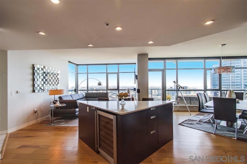 Fabulous Cortez Hill 3 BR/3BA Penthouse with floor to ceiling windows in close proximity to all Downtown enjoyment. Furnished Elegantly & Tastefully Designed. Pano Views of Bay, Cityscape, Mountains, Balboa Park, & Evening Lights. Largest of 3 Units on TOP floor w/NO COMMON WALLS providing the Ultimate in Privacy, Quietness & Sophistication. Wrap Around Balcony Plus Pool/Spa , Fitness/Weight Room and Large Common Lounge. Get to I-5 & 163 in seconds. Perfectly Private & Prestigious . Looking for Long Term. On Short Term Rentals prices will be higher. 2 Side by Side Lower Level Gated Parking. Prestigious 3 Bedroom 3 Full Bath Panoramic View Penthouse in Downtown San Diego. Exclusively Unique; 2401 is considered a Premier Unit within Aria. Custom Interior Design. Unique Neighborhood, Cortez Hill. This home provides the ultimate in privacy & quietness. Offers Elegant living with all Downtown amenities-Restaurants, Nightlife, Farmers Markets, Parks, Little Italy and easy access to I-5 & 163 Freeways. Enjoy nights out full of dining & fun, and come home to your relaxing retreat. Panoramic Unobstructed views of Downtown Cityscape & Bay, Coronado Bridge, Balboa Park, Mountains & Evening City Lights. Floor-to-Ceiling Windows throughout and Prestigious amenities to host Family, Friends & Entertain. Master Retreat Bedroom offers dual vanity, double head rain shower, private Balcony, 2 large closets, and views of Balboa Park, Panoramic Mountain Ranges(s), Lindberg Field including Harbor, Point Loma and Beyond. The 2nd Bedroom has its own access to a Large Wrap Around Perimeter Balcony to Living and Dining areas. 2401 comes complete with side by side parking stalls 1 & 2 and possible Storage Area. Also has a wine refrigerator.